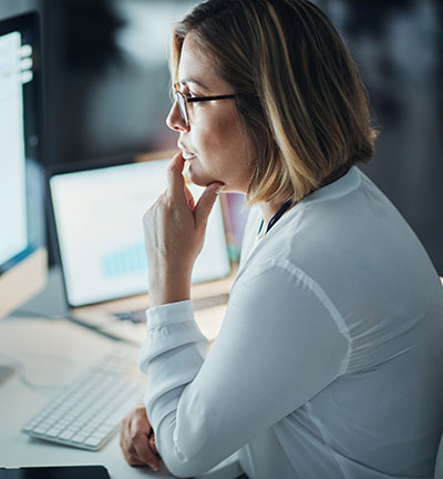 Professional woman at desk, working at computer with email and writing article at digital marketing agency. Focus, web design and typing at desktop PC with female copywriter, notes and SEO content lanee headshot 1